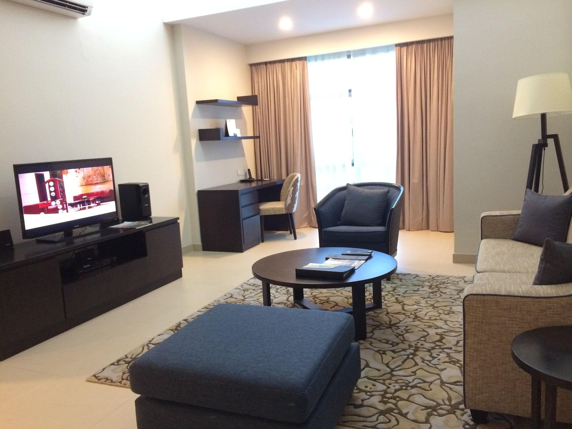 Somerset Хошимин Екстериор снимка Living room of a suite at the hotel